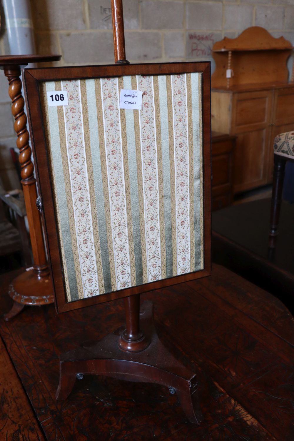 An early Victorian mahogany adjustable polescreen, height 136cm